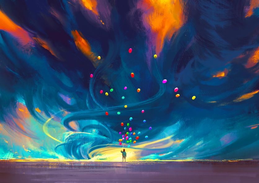 A man with balloons under the colourful Sky